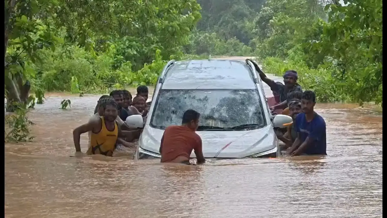 Teacher swims to safety as floodwaters sweep away car, driver rescued after 2 hours