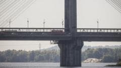 Russia targets busy bridge in central Kyiv in broad daylight