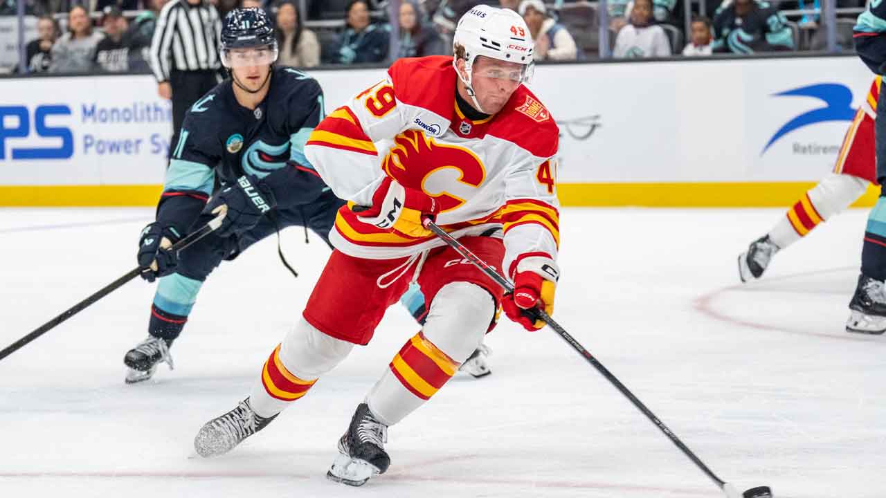 Flames trim camp roster to 27 players with Basha, Brzustewicz assigned to AHL